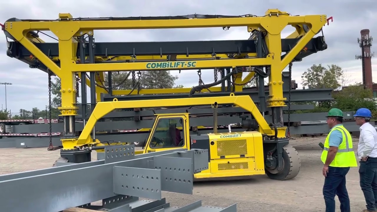CombiLift straddle carrier carrying a load of steel