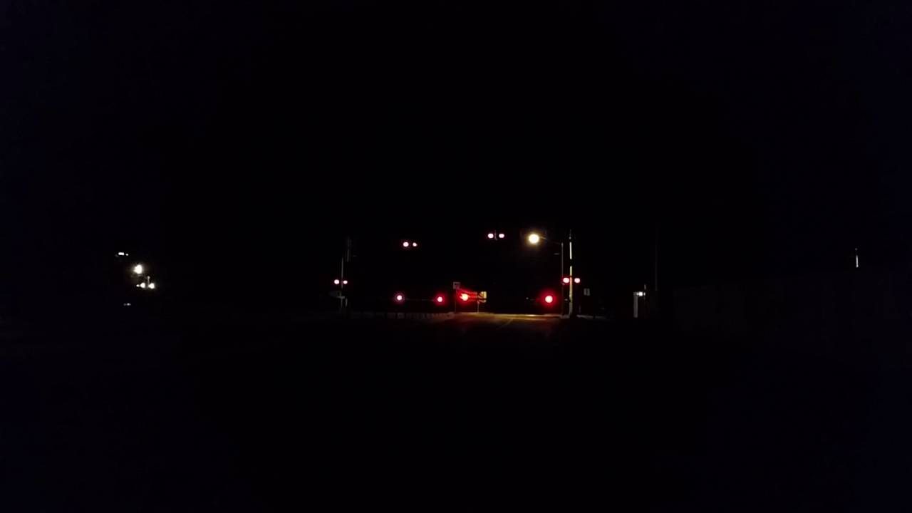 Railran night time train acceleration at crossing