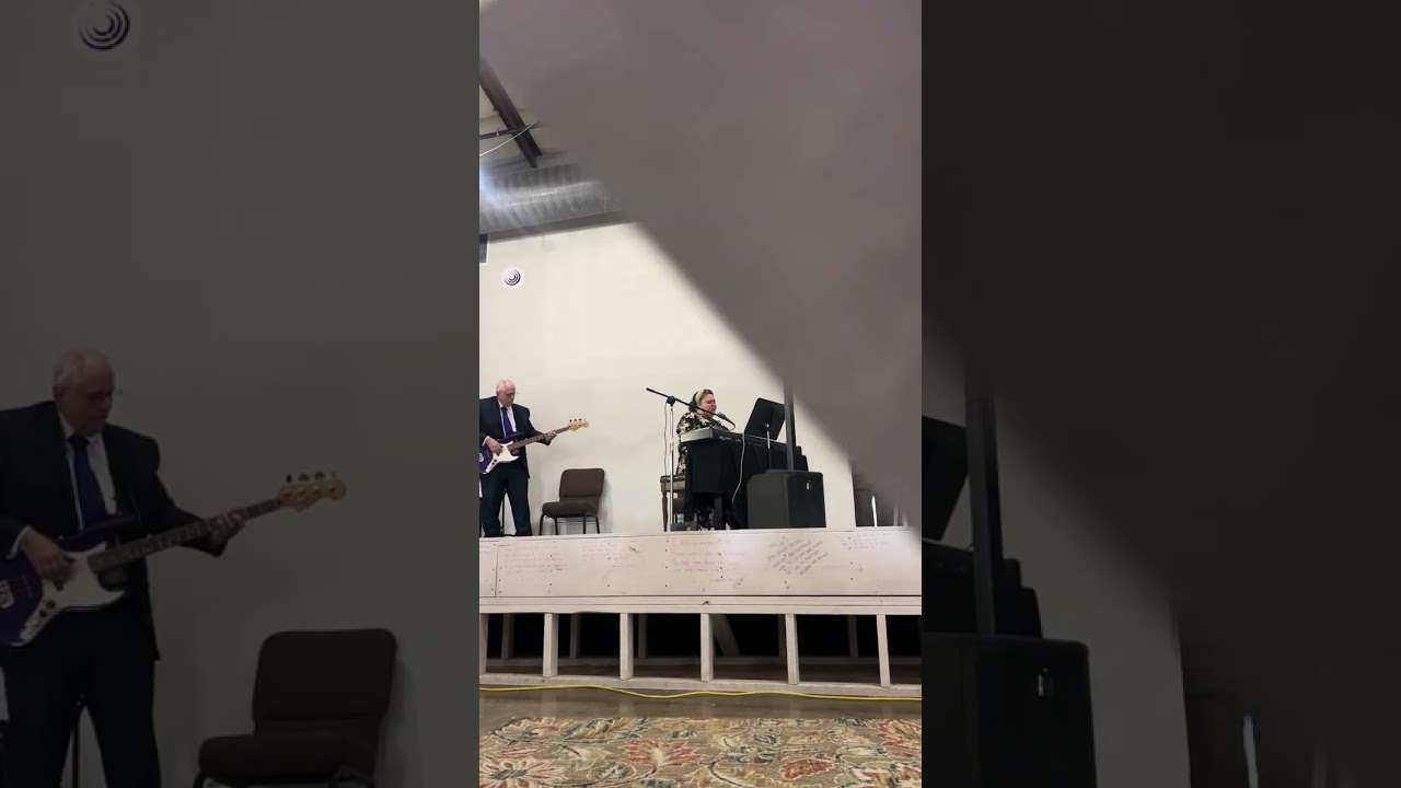 Singing , worshipping at The Pentecostals of Smyrna Church 
