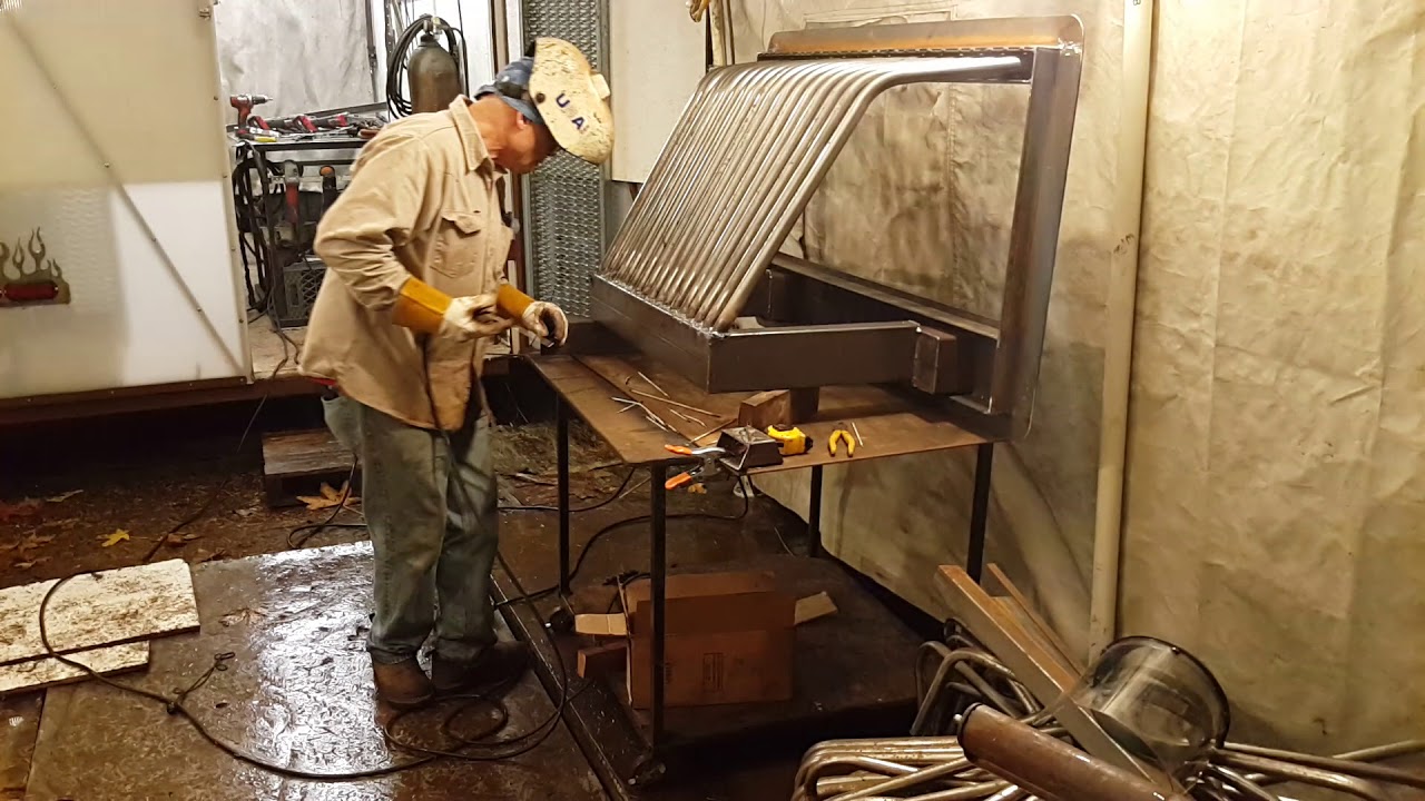 Hammer Time, finish welding massive heat exchanger on custom Fitted glass door fireplace inserts.