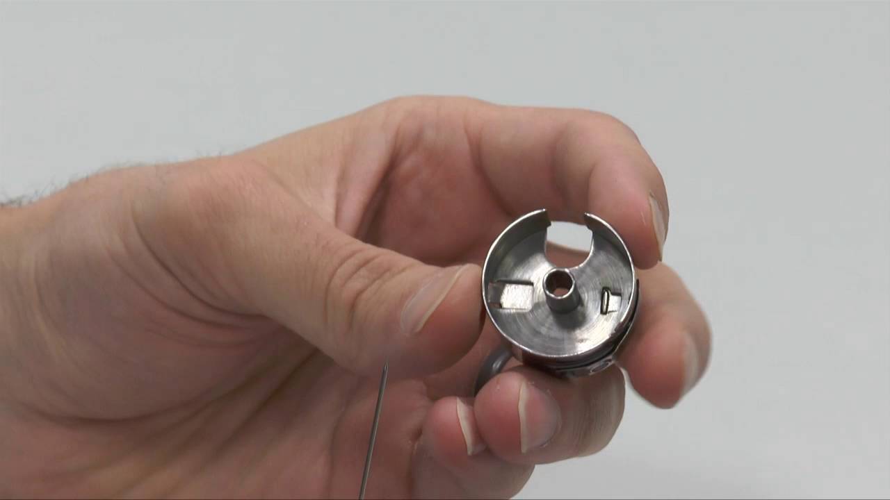 Reinstalling the bobbin case spring