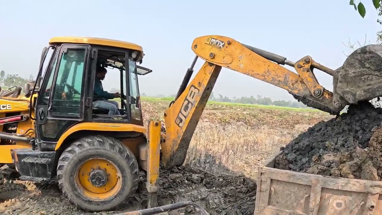 How is JCB loading soil?