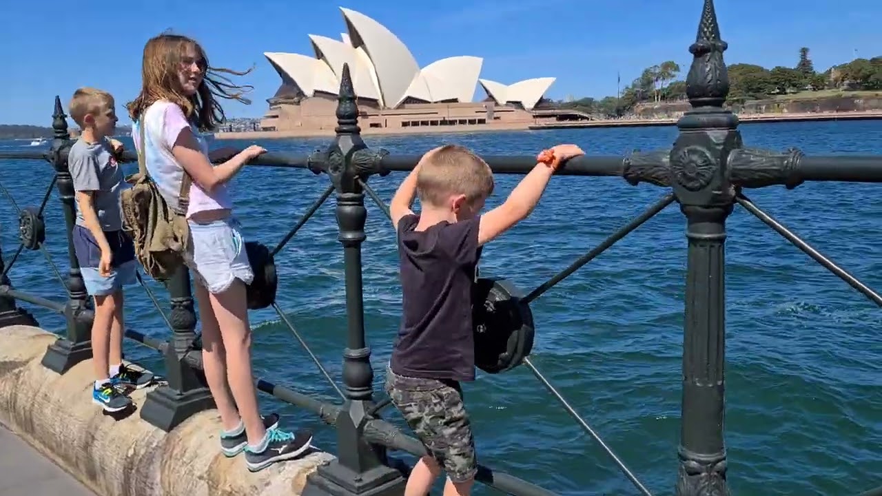 Kids playing looking at Sydney Opera House