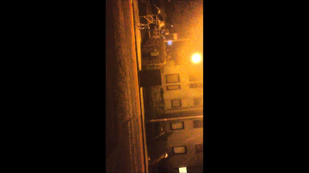 Girl in street popping & clicking bubble gum