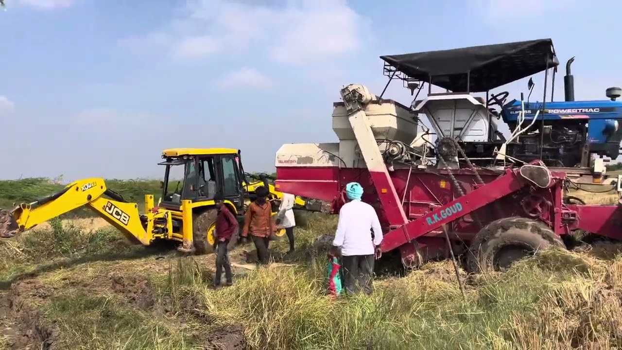 4x4 Harvester stuck in deep mud || Mahendra 575 and JCB helped by pulling out ||