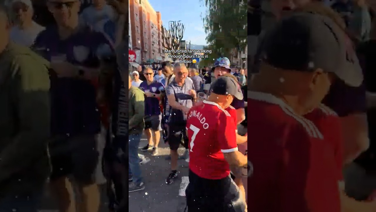 United fans SOAKED with beer as they walk through the Tottenham crowds in Bilbao 🍻😅