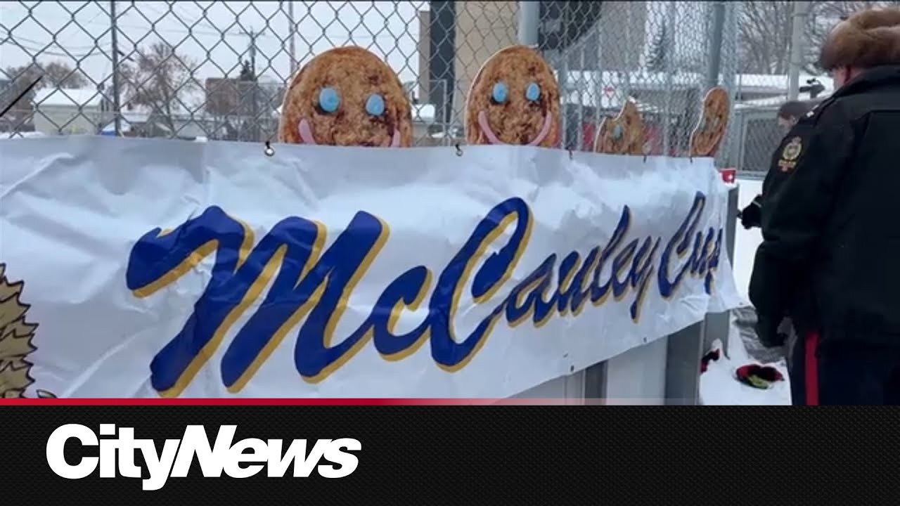 Edmonton Police face off against youth in a hockey game