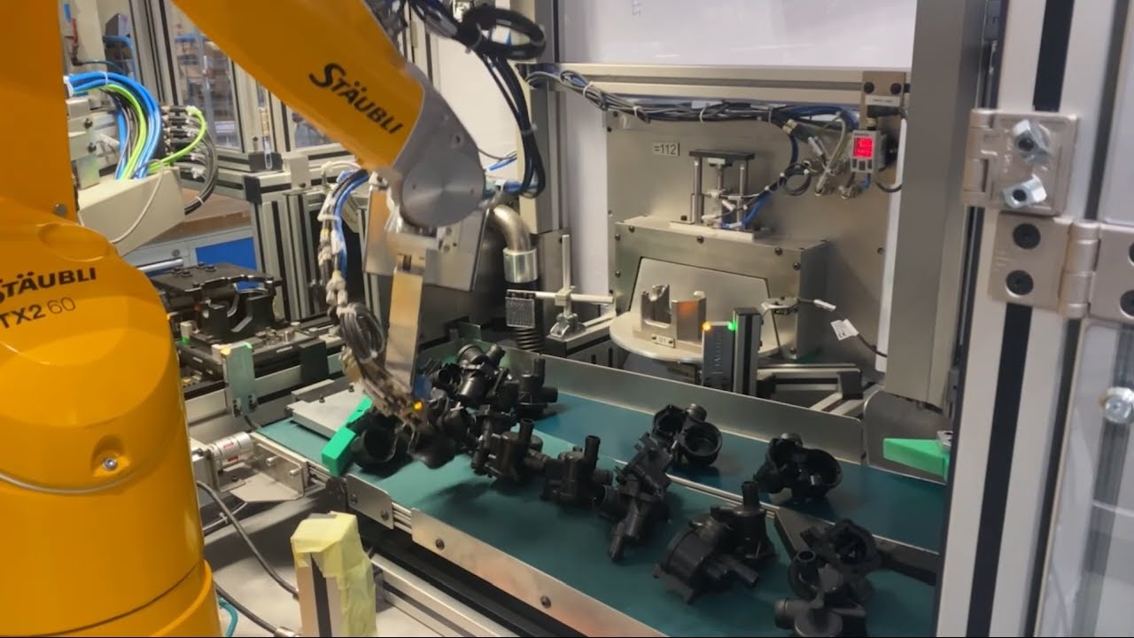Black parts picking and feeding robot station