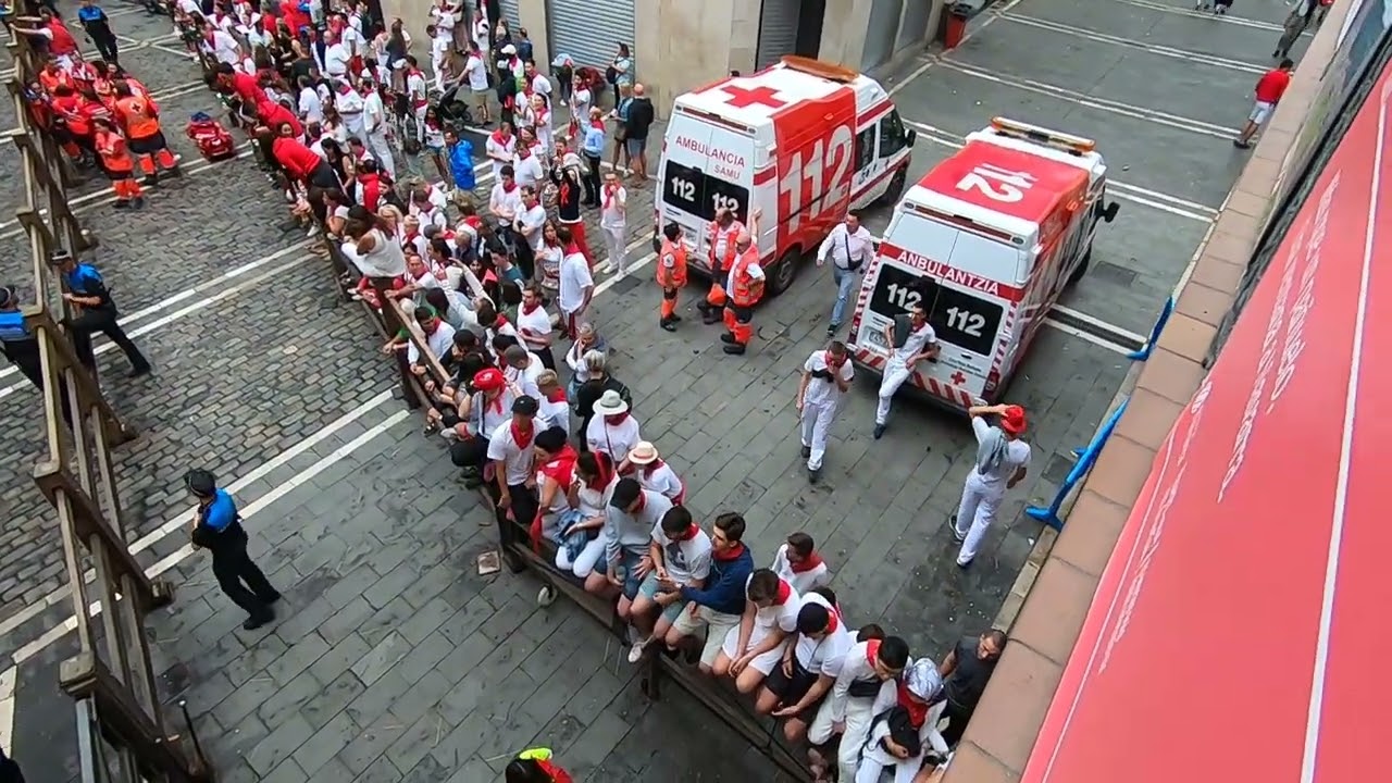 watching the bull run from a balcony