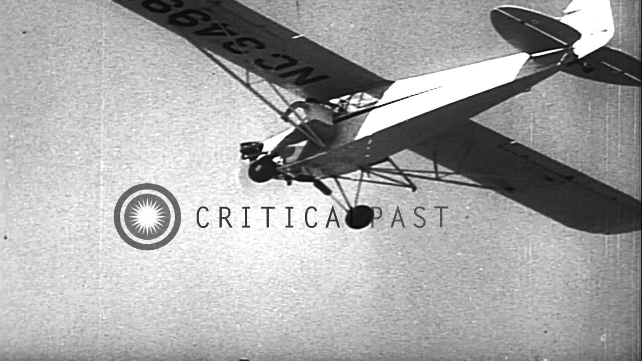 A man climbs a ladder attached to a plane and performs stunts during Dixie air sh...HD Stock Footage
