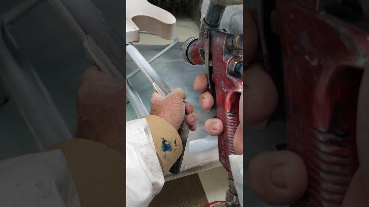 Spraying Shoreline Gold on a double bound Telecaster.