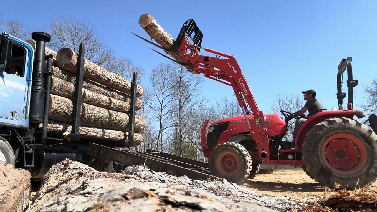 Tractor loading logs, skating logs plus wheelchair ramp