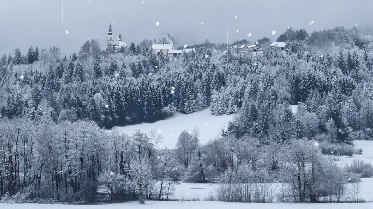 Relaxing sounds of rain and a peaceful covered in snow landscape with a church on the hill
