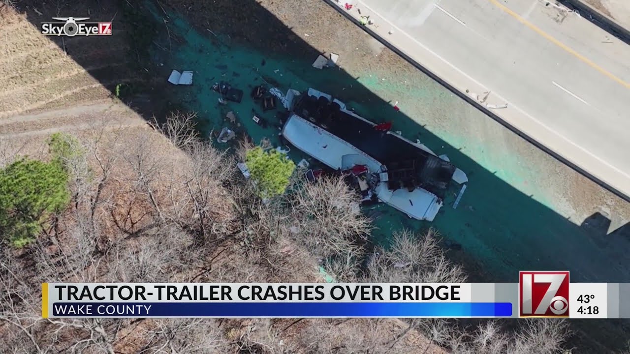 Tractor-trailer goes over bridge in Raleigh