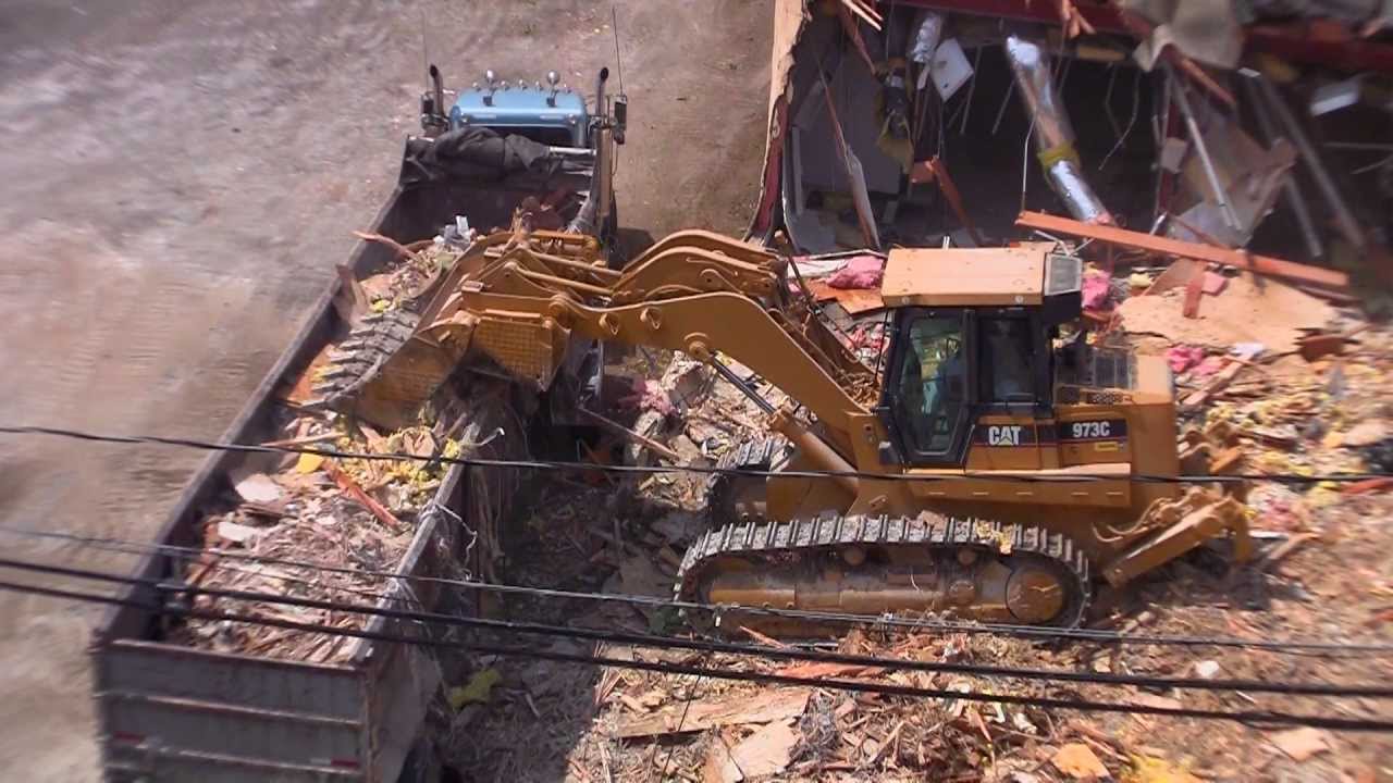 Track Loader Fills Dump Truck at Demolition Site