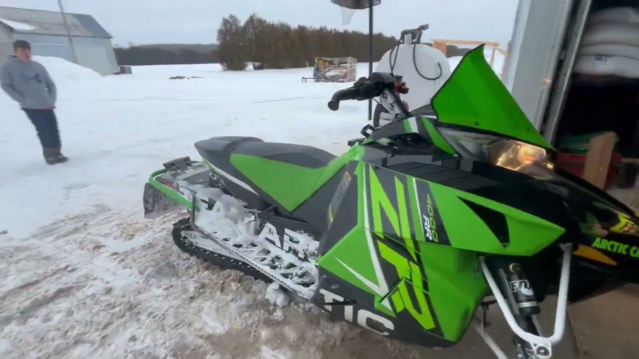 Going for a ride around the field with Arctic cat ZR 4000 RR snowmobile ￼