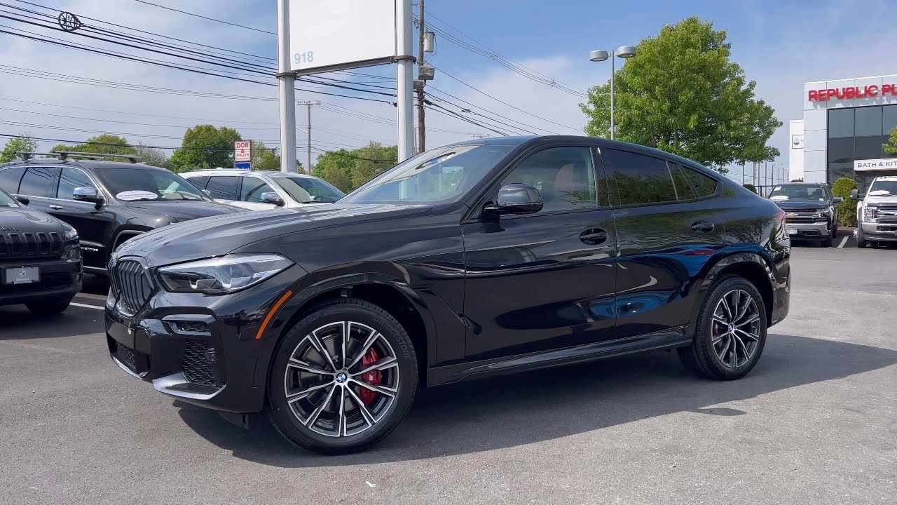 2022 BMW X6 in Black Sapphire with Fiona Red Interior