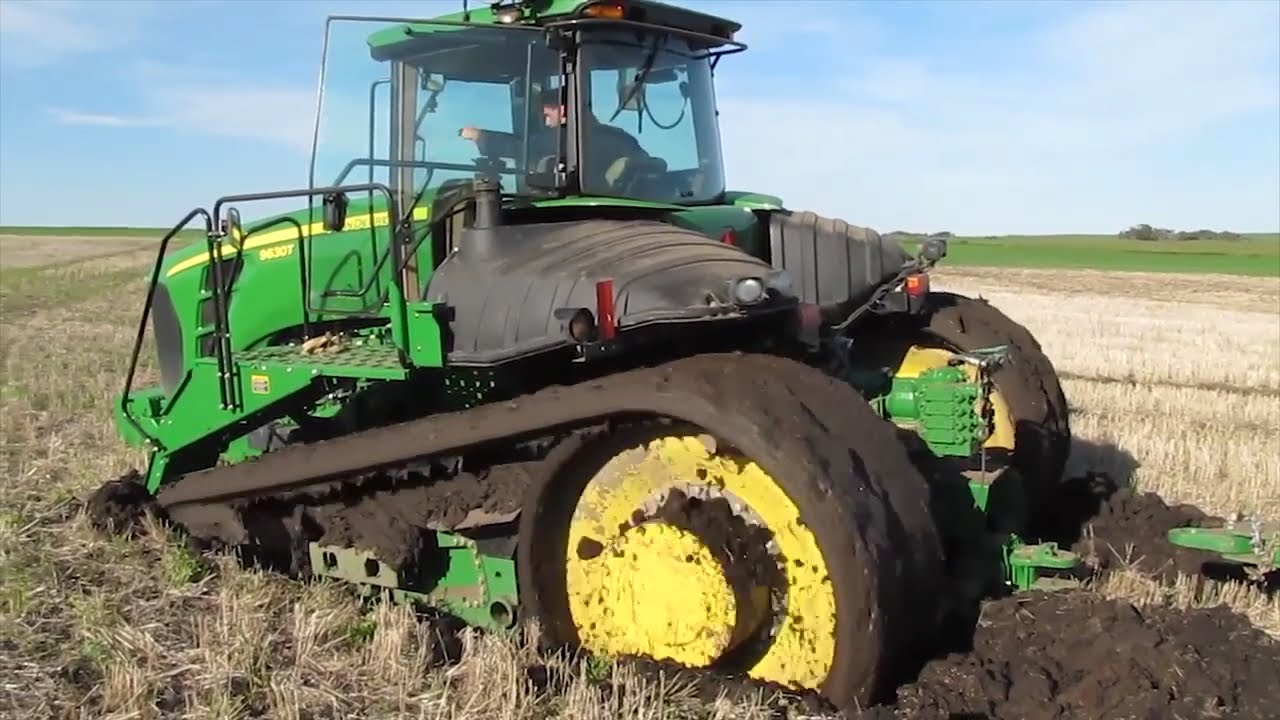 John Deere tractors got stuck in the mud . The drivers got into a difficult situation