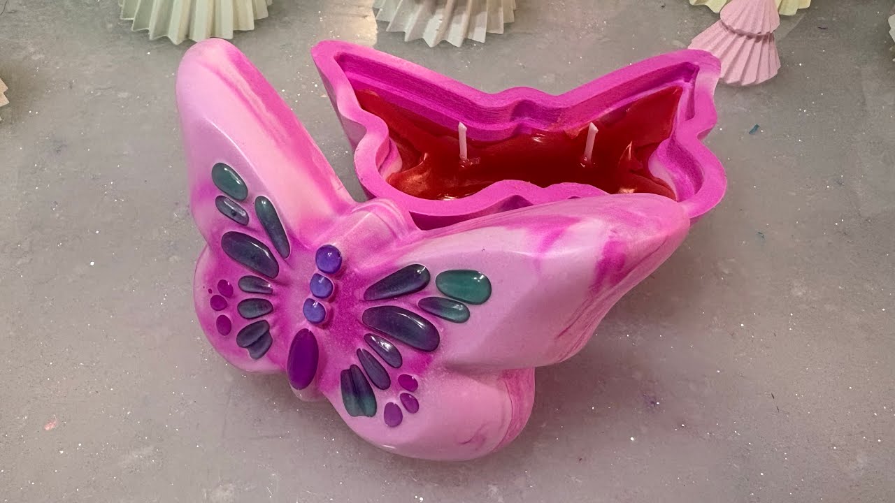 Two toned fluorescent butterfly candle with coloured UV resin