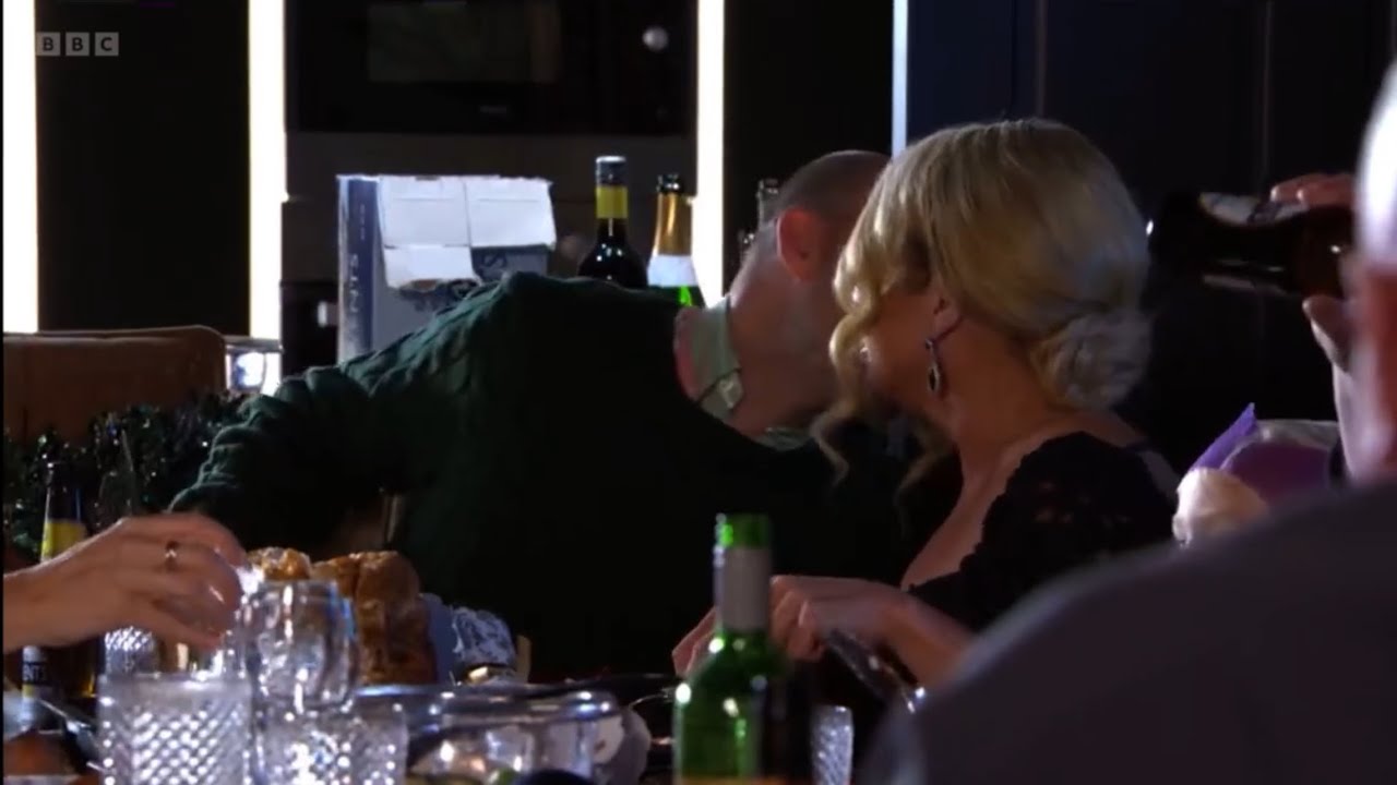 Eastenders Phil walks off from the Christmas dinner as he sees teddy kiss Sharon scene