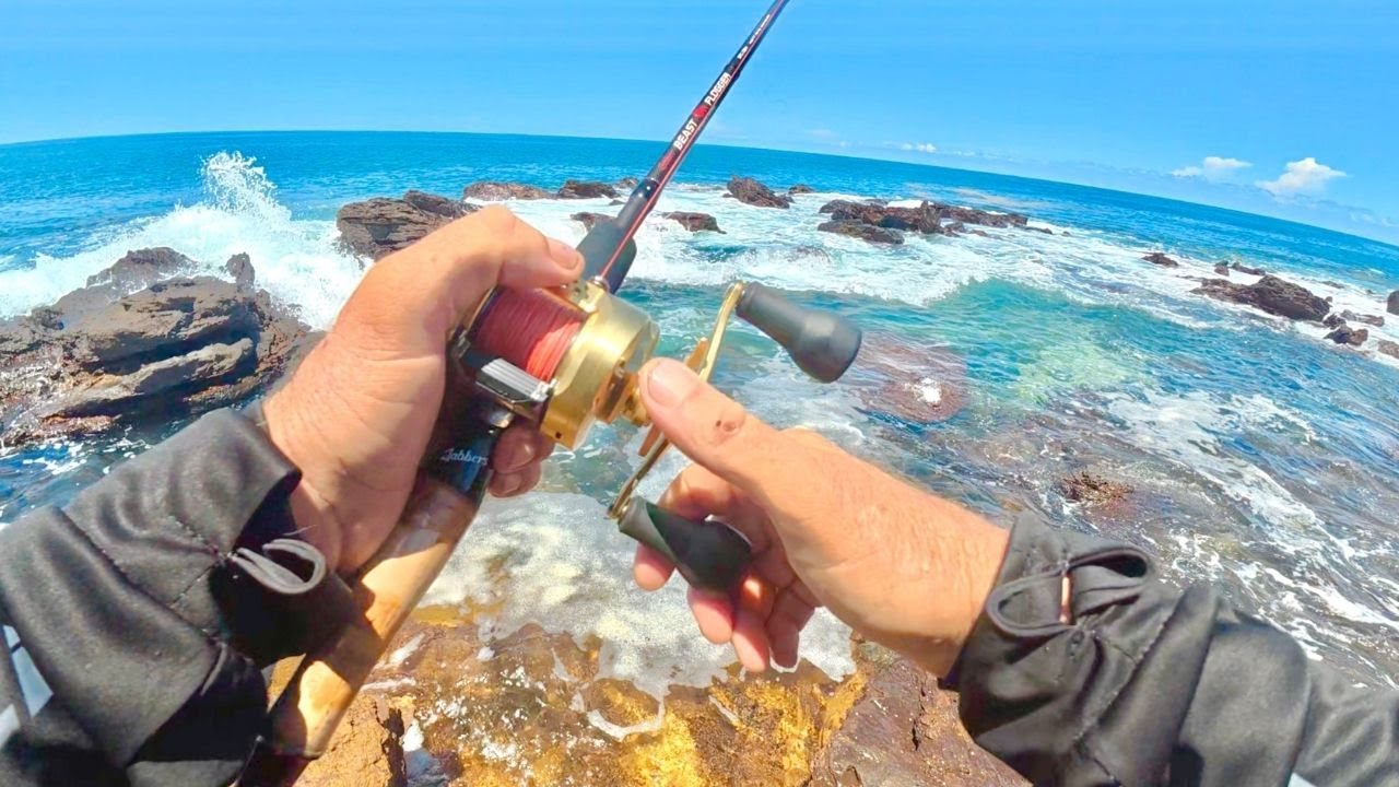 SHE OUT FISHED ME..FISHING OFF THE ROCKS..