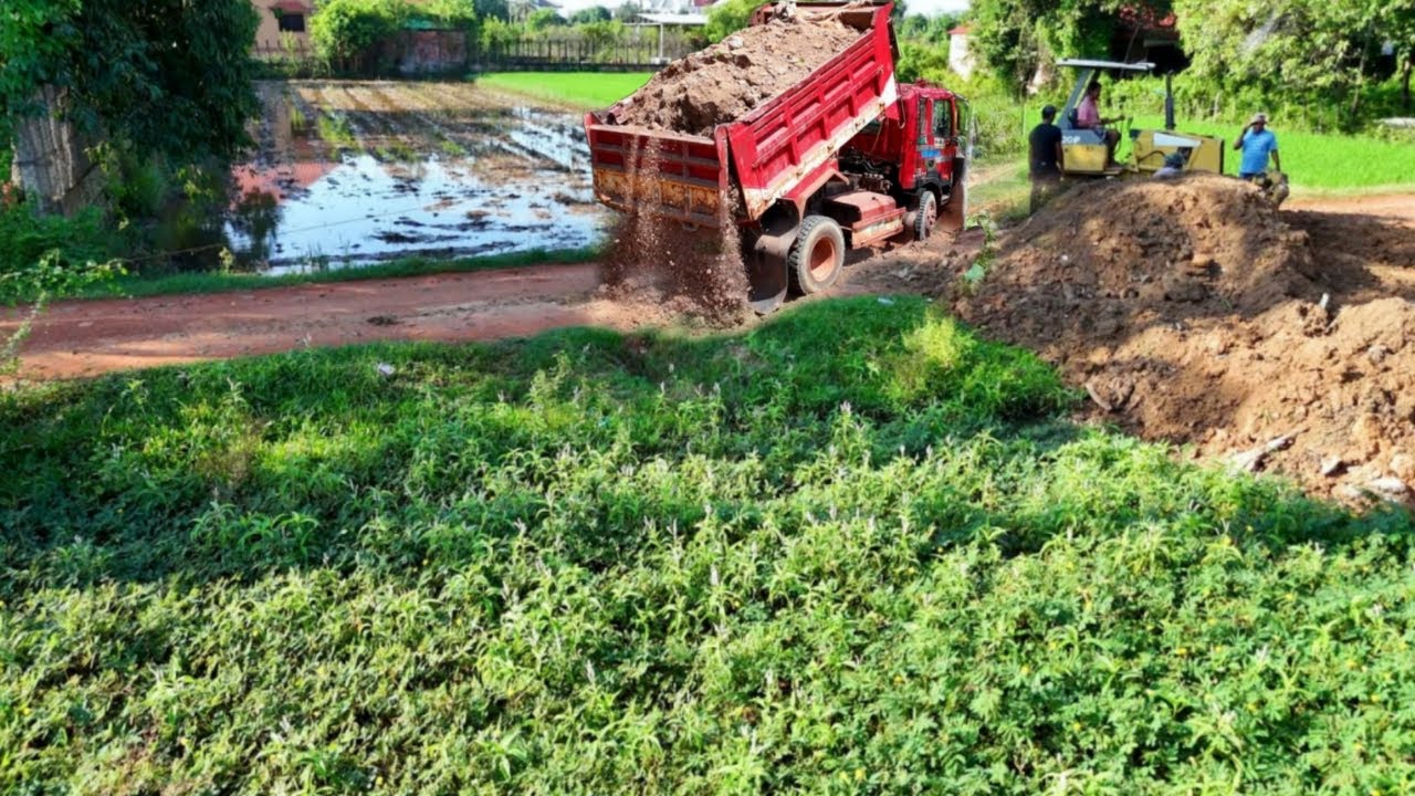 Nicely Starting New Project Filling Up Land On Flooded Area by Bulldozer Pushing With 5-T Truck Load