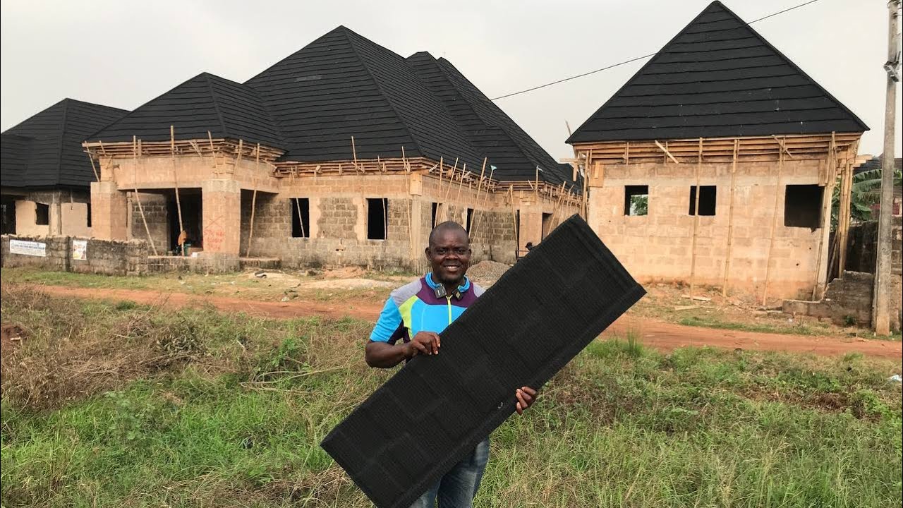 This Two Buildings Behind This Man Was Roofed With Stone Coated Roofing Sheets With This Fee In Edo.