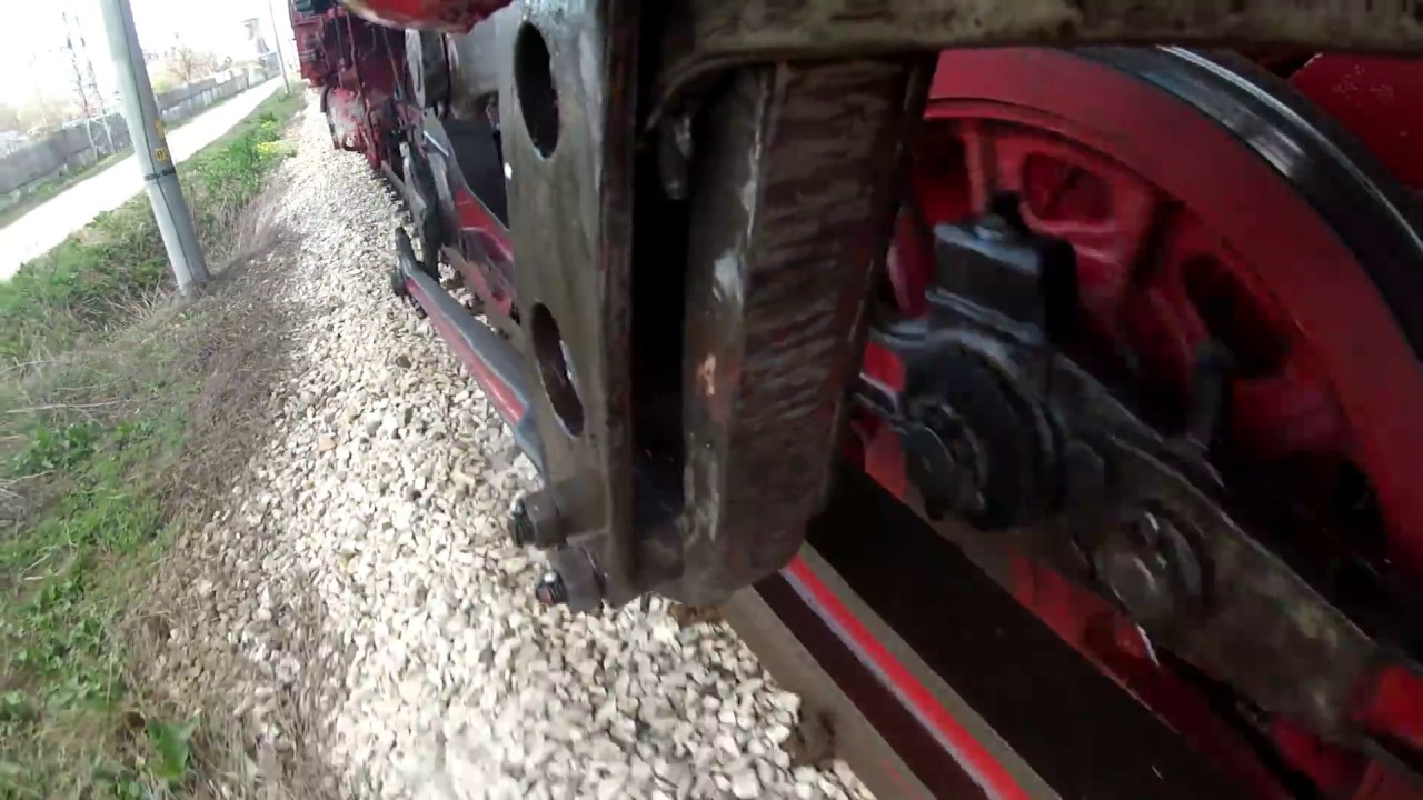 The driving gear of a running steam locomotive