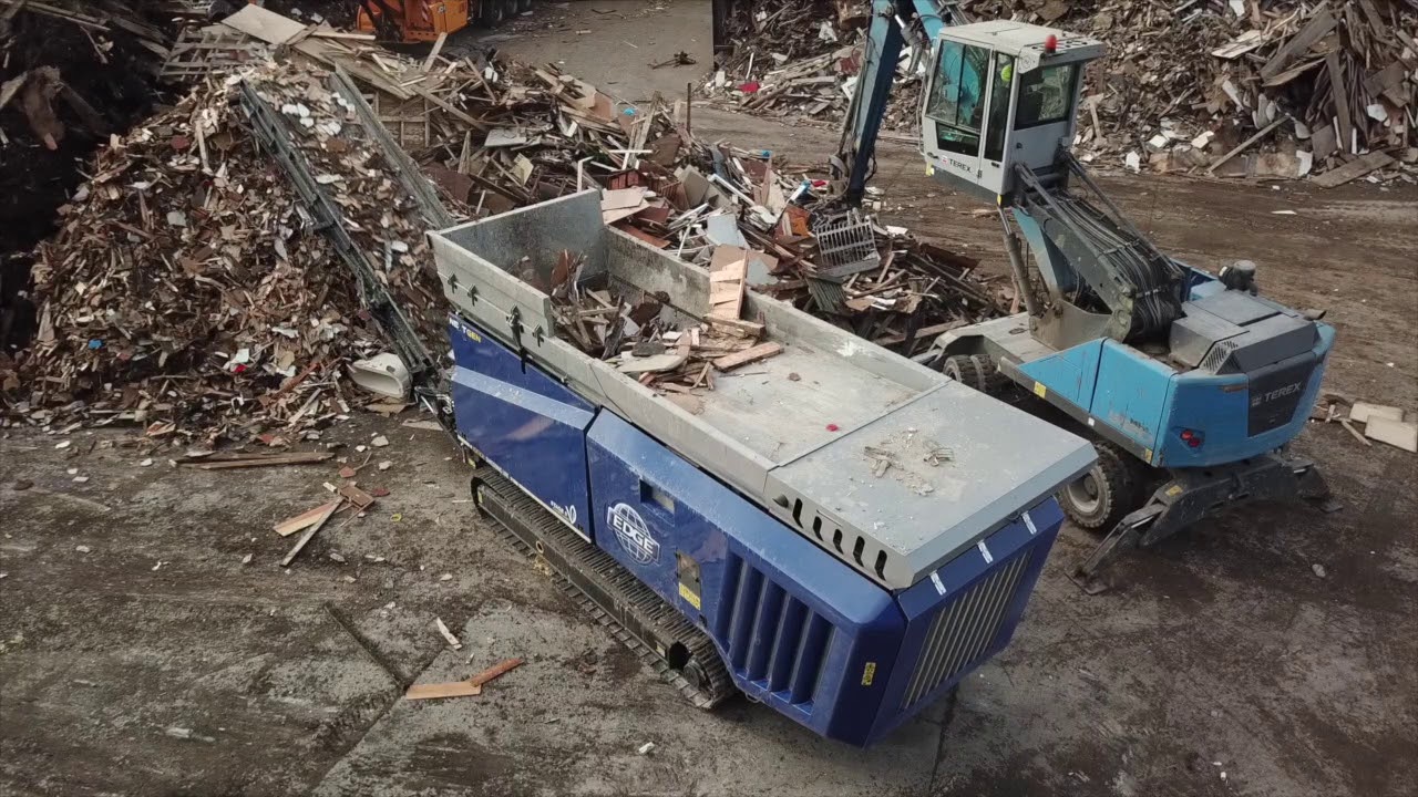 Watch the EDGE Shredder DESTROY Construction and Demolition wood waste.