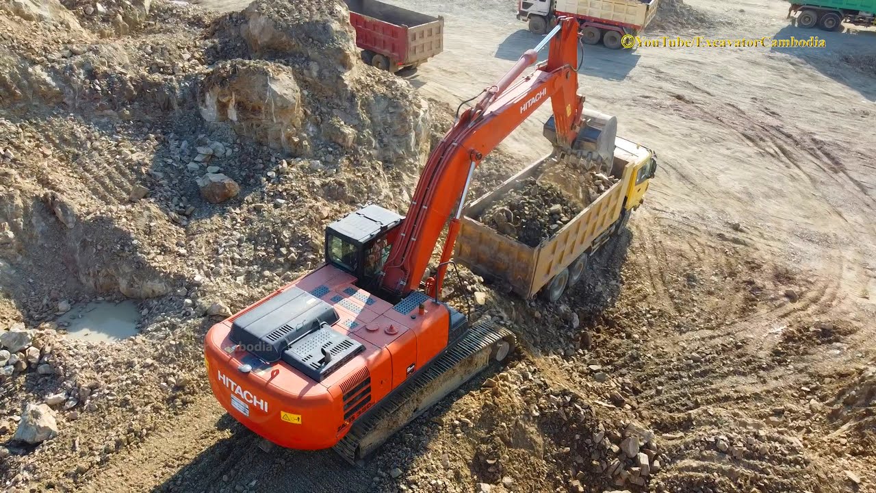 Heavy Excavator Clearing And Loading Into Dump Truck - Excavator Cambodia