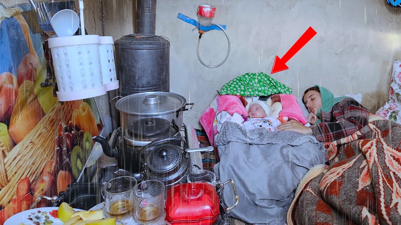 The heavy sleep of Negar's mother and her baby on bed of dreams in a rain Storm