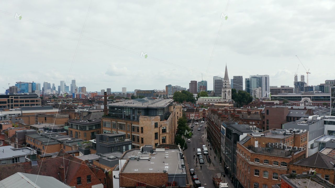 Aerial panoramic view of urban neighbourhood. Descending footage with modern skyscrapers in