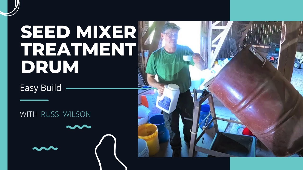 Mixing seed in a drum mixer.