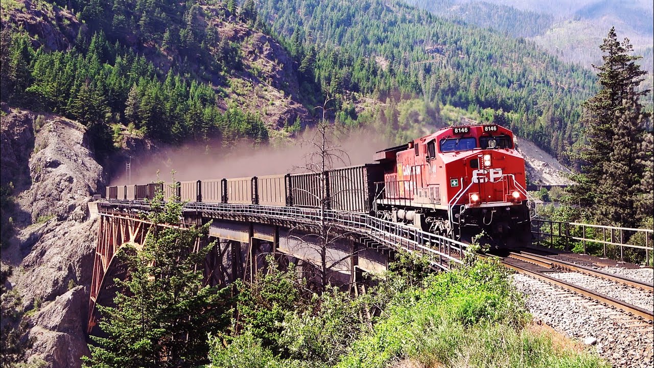 Unbelievable Coal Dust Blown OFF Train Over Cisco Bridge, And 2 People Seen Train Hopping Riding Car
