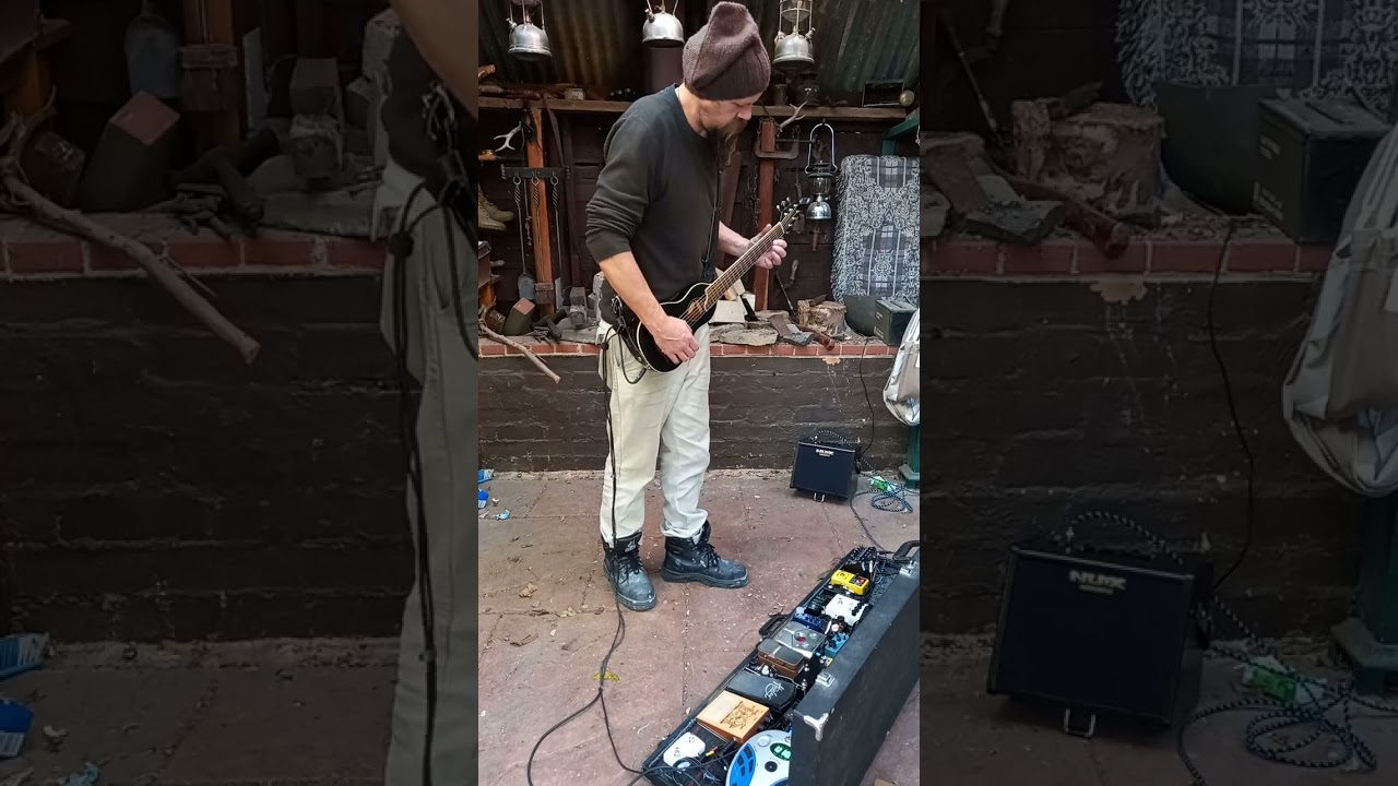 Improvised loop jam with my busking setup. Washburn Rover travel guitar with foot percussion pedals.