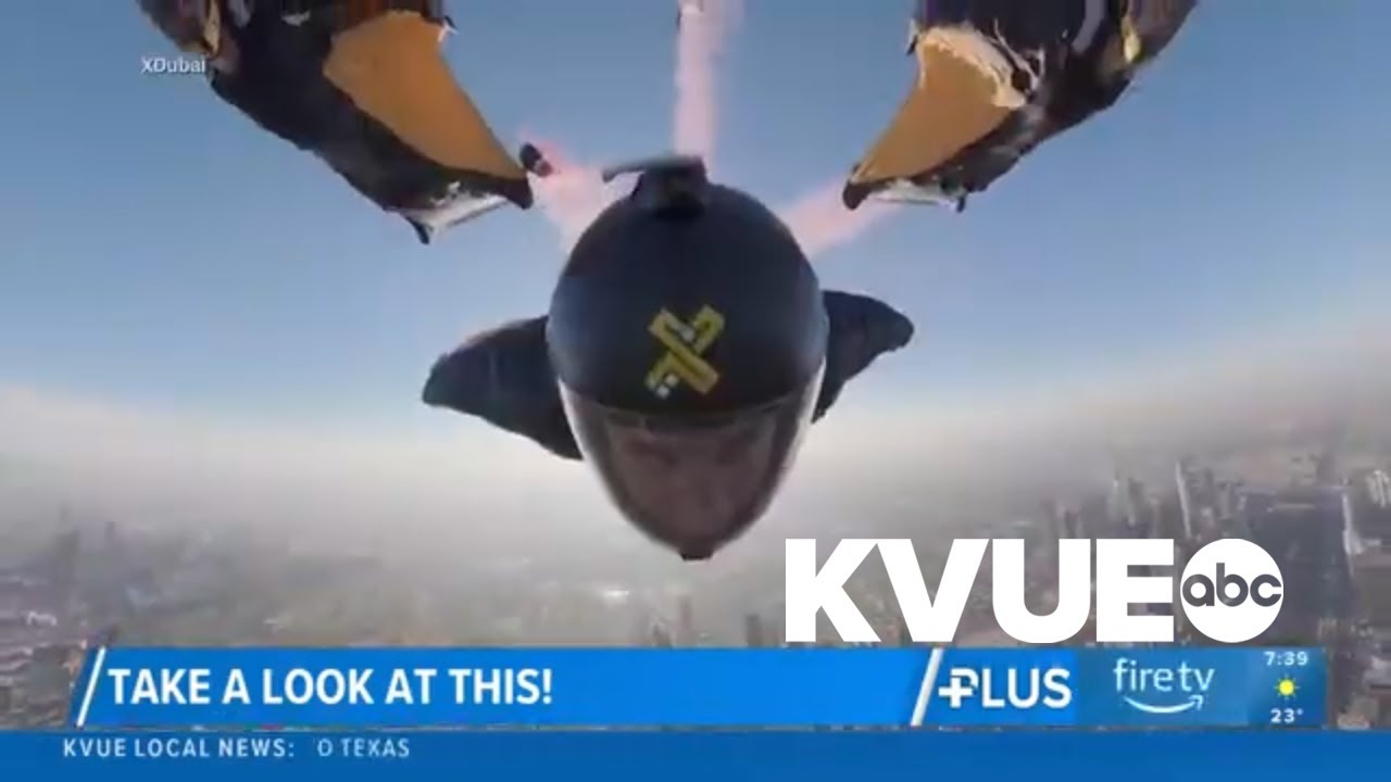 Skydivers fly through skyscraper in Dubai
