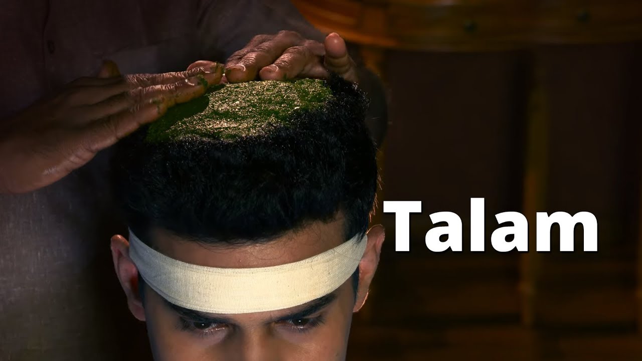 Applying Medicated paste on the forehead - Talam (Thalam)