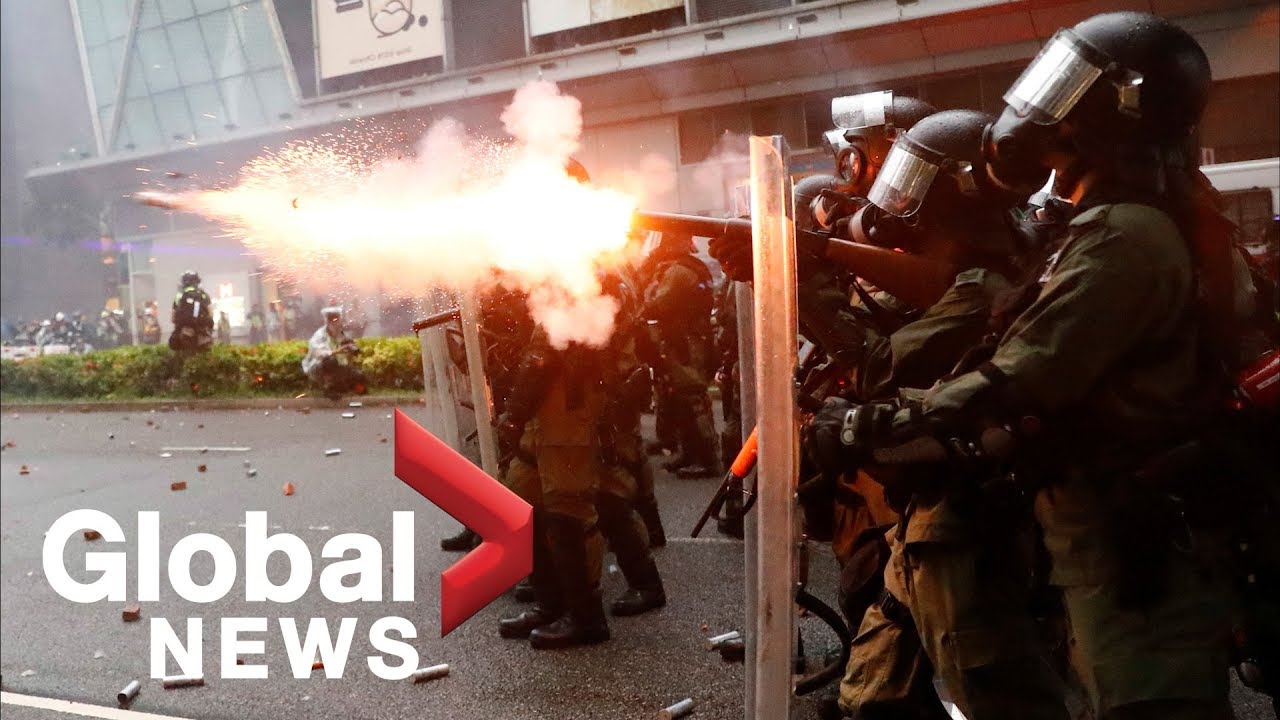 Hong Kong police fire water cannons, tear gas as protesters take to the streets