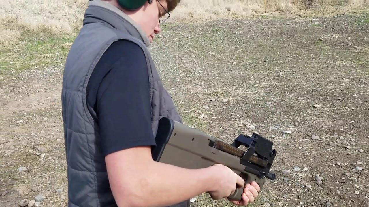 FN P90 fired by 13 year old for the first time with his reaction.