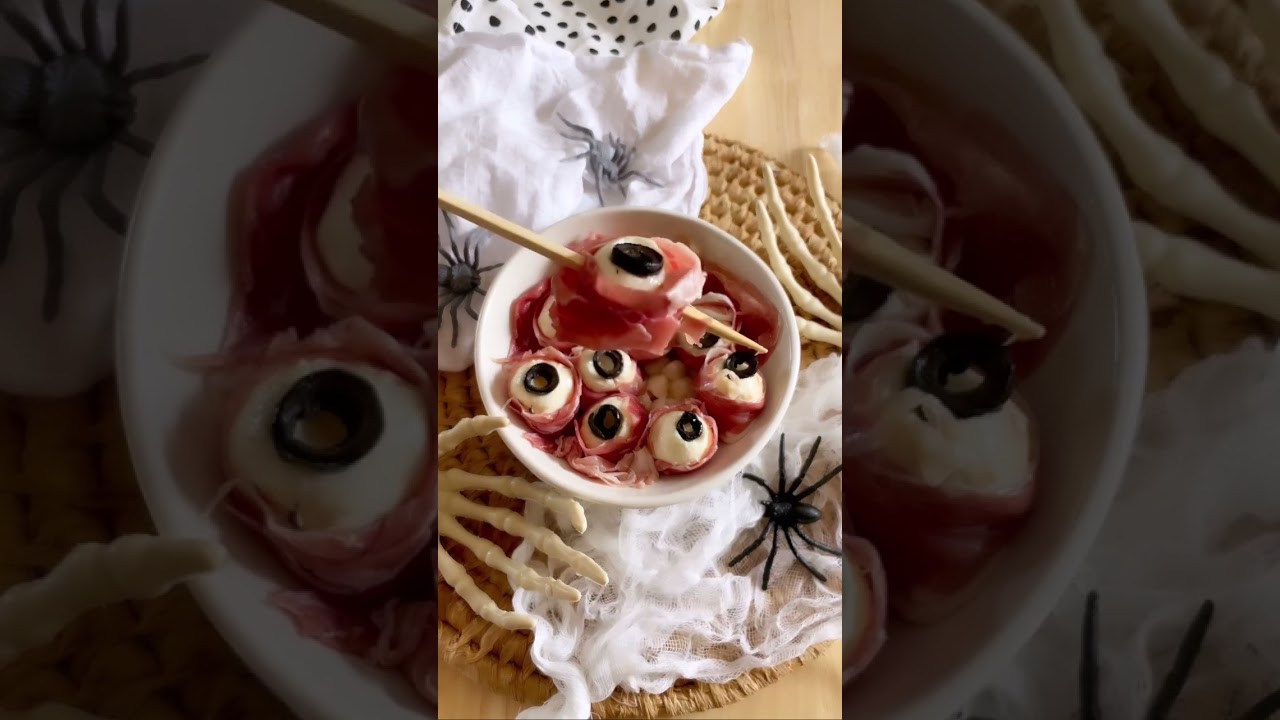 These delightfully eerie Halloween Mozza Eyes are a must make! Creamy mozzarella balls, black olives