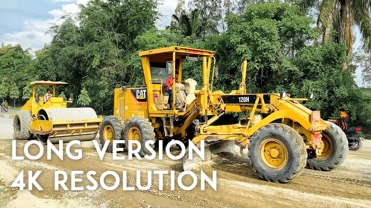 ROAD CONSTRUCTION: CAT 120H Grader and SAKAI Compacter Working in Public to Construct Main Road