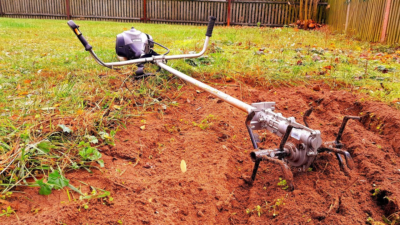 Cultivator attachment for a petrol brush cutter