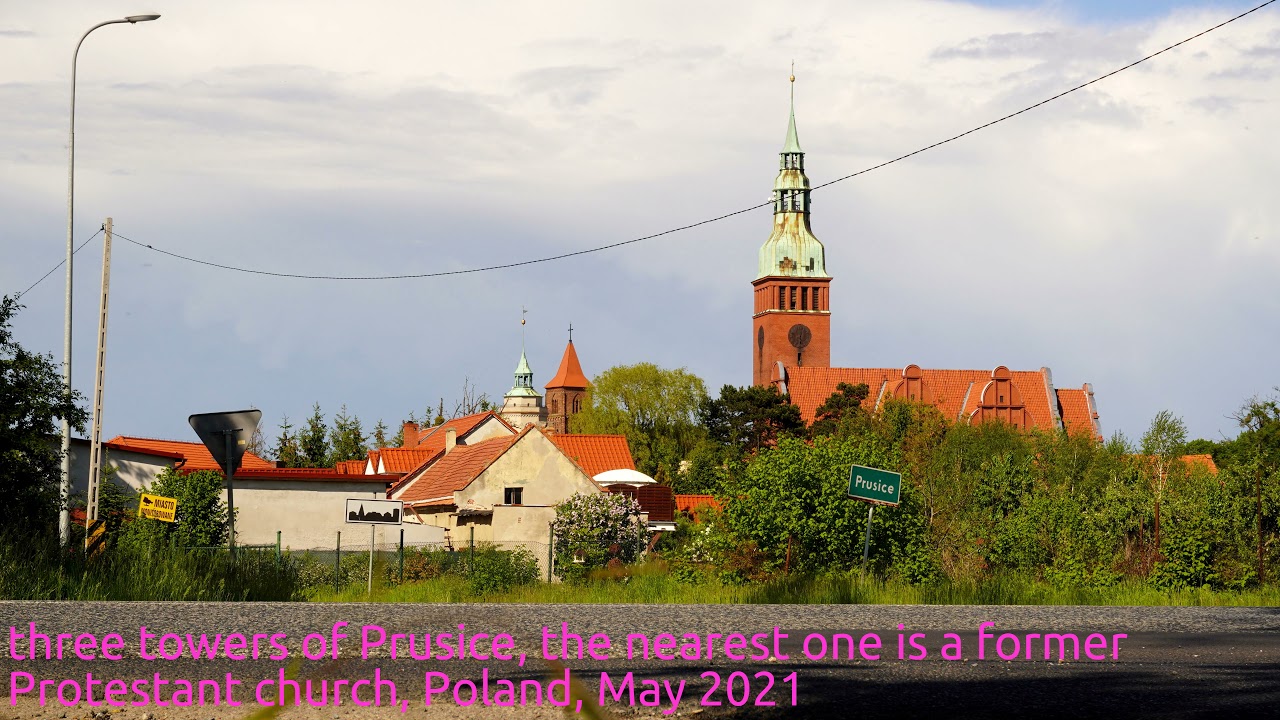 three towers of Prusice, the nearest one is a formerProtestant church, Poland, May 2021