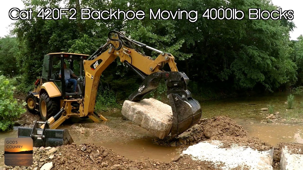 Cat 420F2 Backhoe Moving 4000lb Stepping Stones