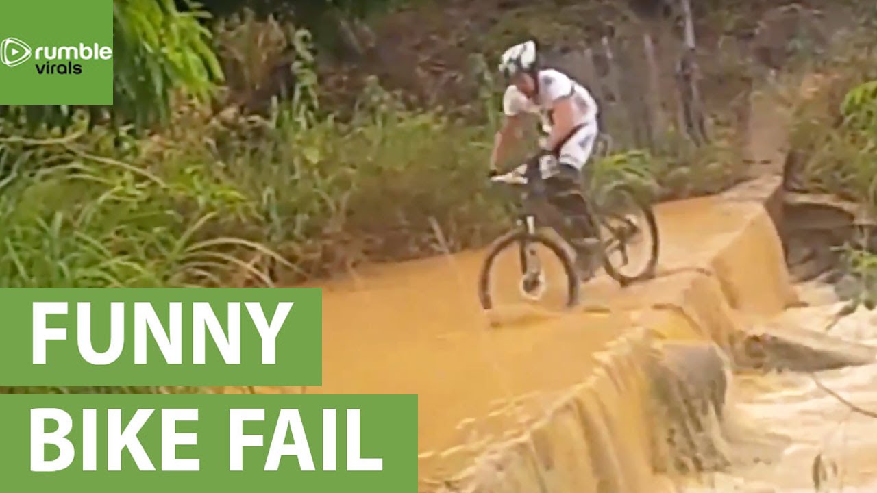 Epic fail: Guy on bike falls into river