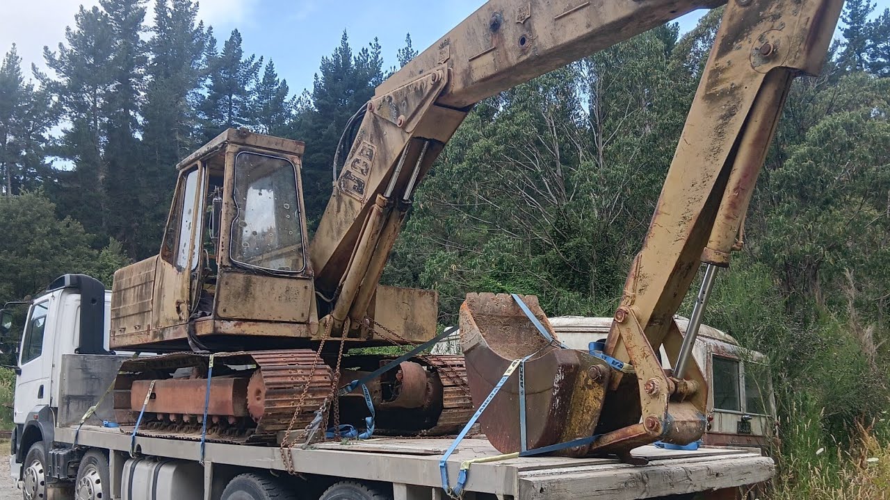 A vintage JCB digger has arrived in the yard.