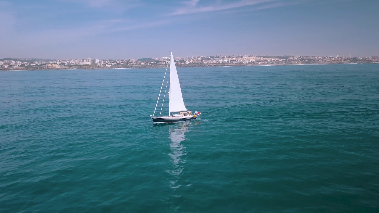 Aerial View 4K - Boat sailing in Cascais bay