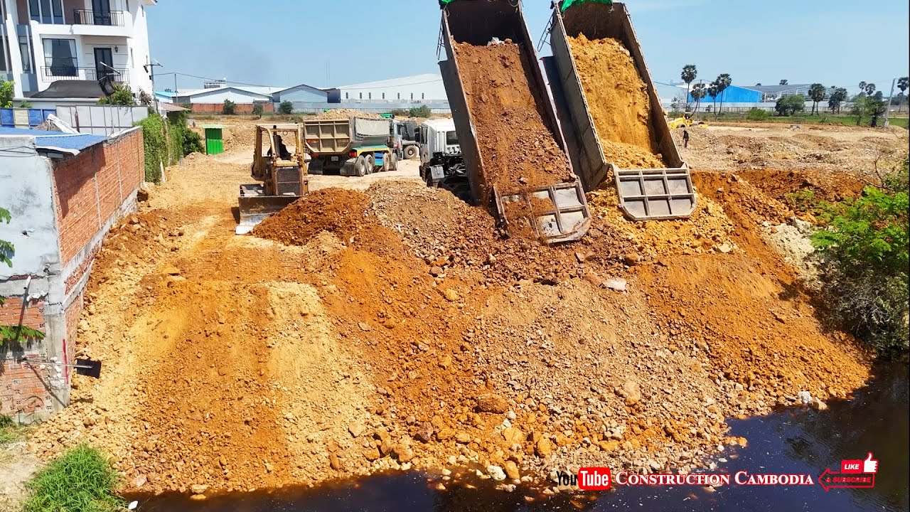 Great Jobs! Fast skills Komatsu D58E Bulldozer push stones filling in water & build road foundation