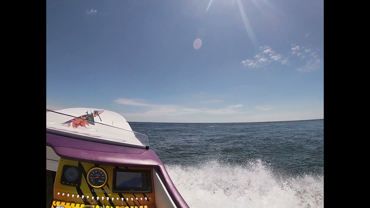 Cigarette and Apache boats leaving the Merrimack river