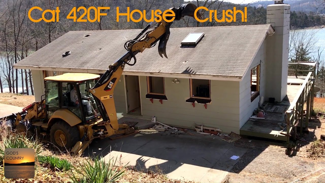 Tearing a house down with Cat 420F with PSM Tilt Coupler